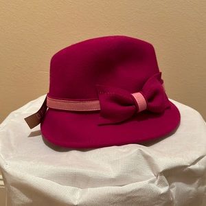 NWT. Pink and red woman’s hat with bow. 100% wool.